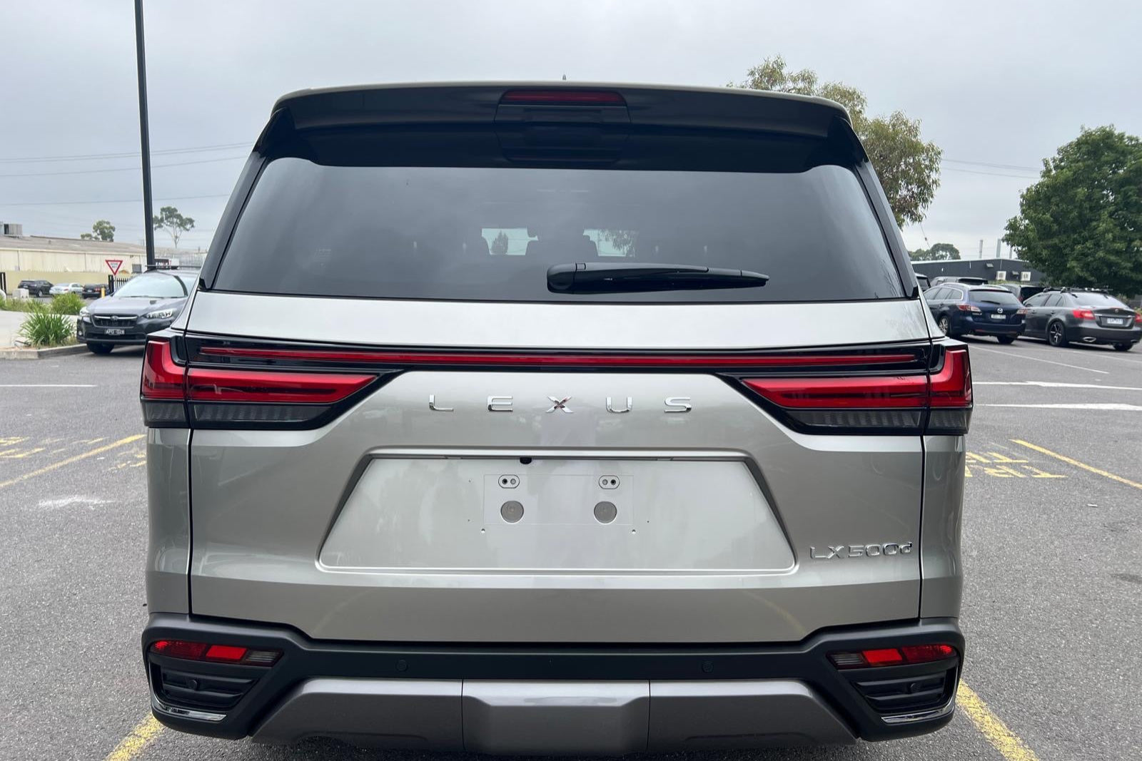 Lexus SUV rear view in a parking lot