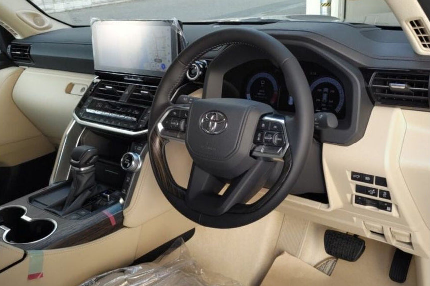 Car interior image on a mobile app interface with bidding information.
